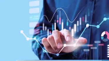 Person analyzing interactive digital charts and graphs on a screen.