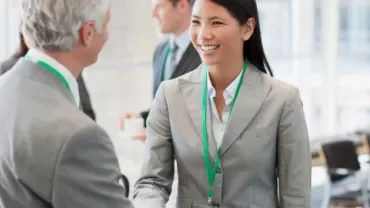 woman and man shaking hands