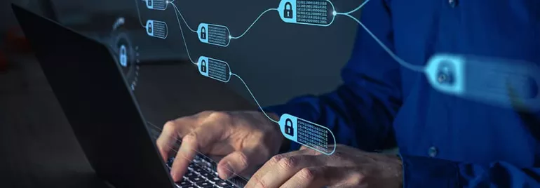 Person typing on a laptop with blockchain symbols and digital locks overlaid.