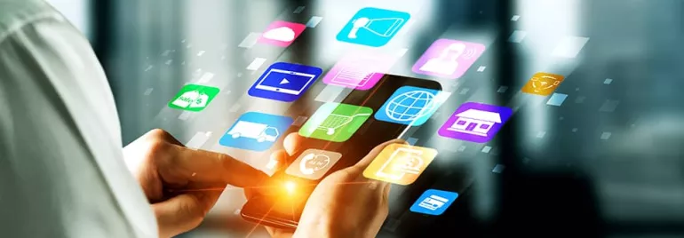 Person using a smartphone surrounded by colorful app icons.