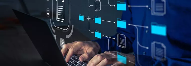 Person typing on a laptop with overlay of digital file and folder icons