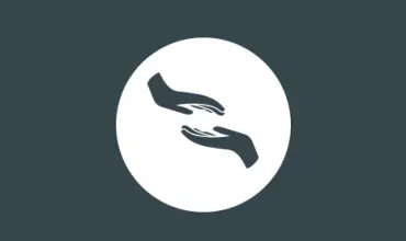 Icon of two hands reaching towards each other in a circle.