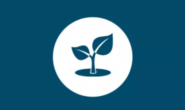 Icon of a sprouting plant with two leaves inside a white circle on a blue background.
